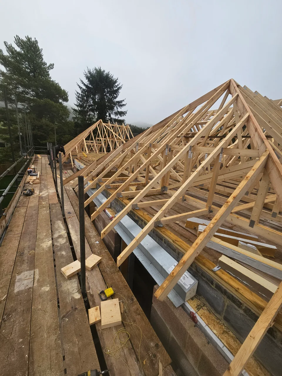 Hand-cut roof timbers forming the structure of a roof
